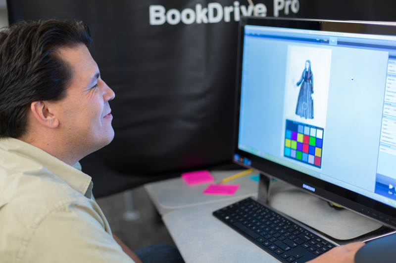 Student worker using scanning software.